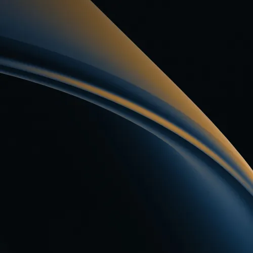 A sweeping dark arc edged with a warm highlight